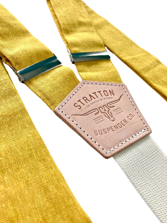 Stratton Suspender Co. features the Yellow linen suspenders on veg tan shoulder leather with cream colored elastic back strap for the Fall 2022 suspenders collection