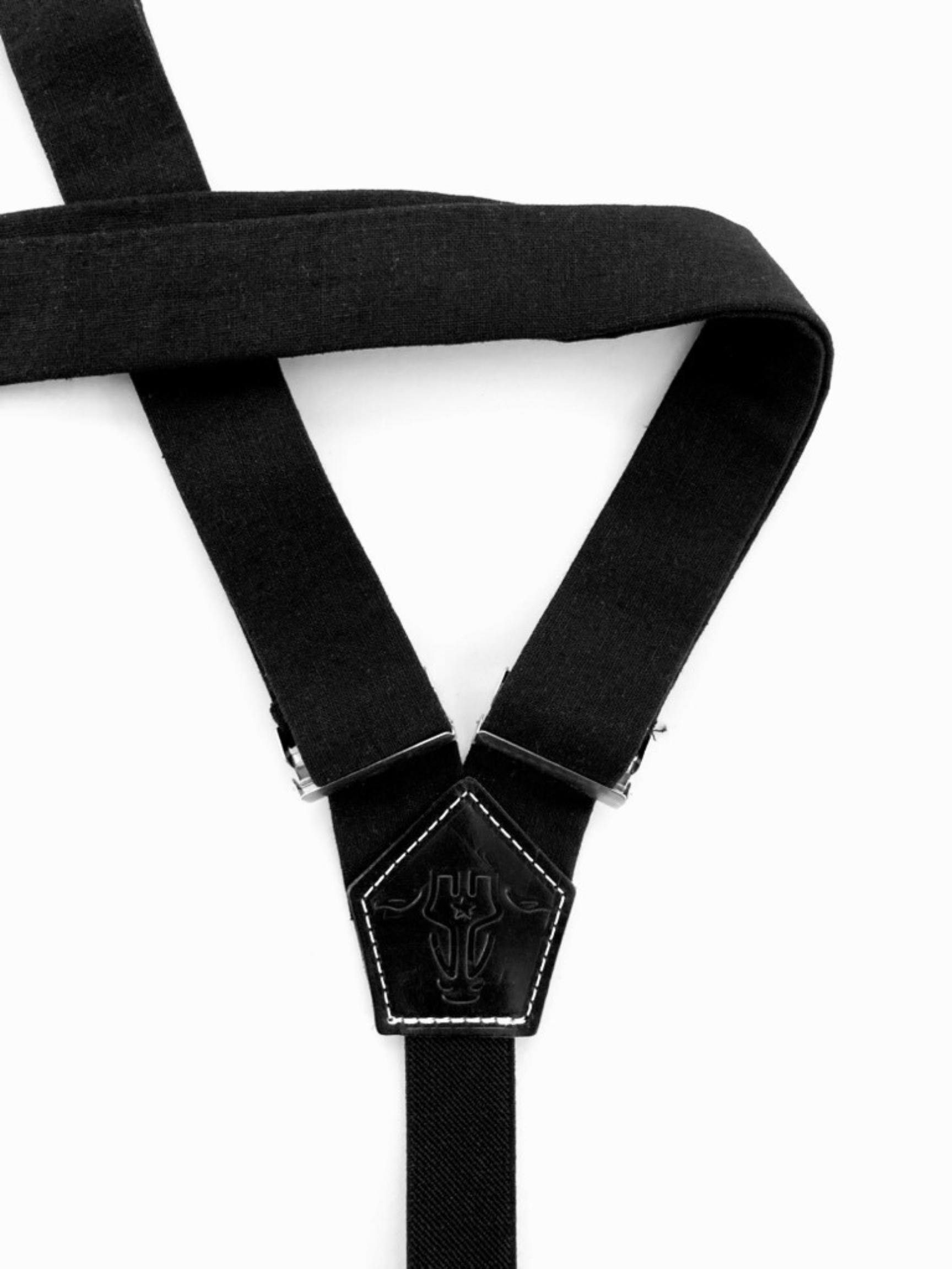 Back view of black linen women’s suspenders with stitched leather patch – handmade in Texas