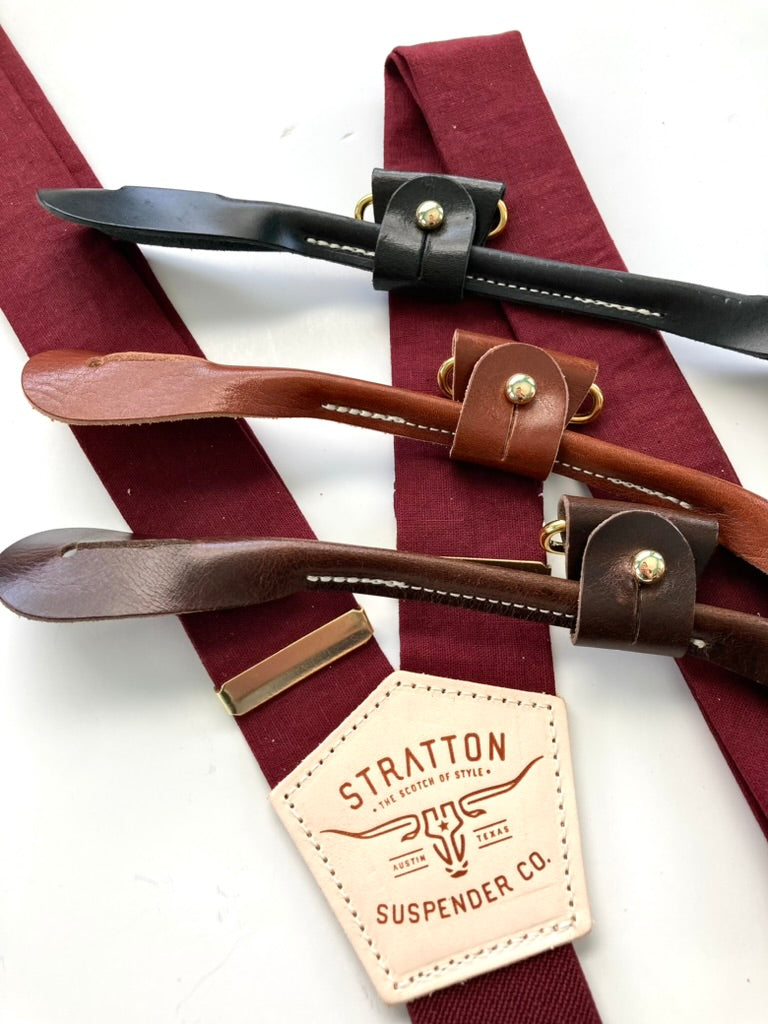Handmade Bordeaux suspenders with black, tan, and chocolate leather button tabs and gold hardware, perfect for groomsmen outfits.