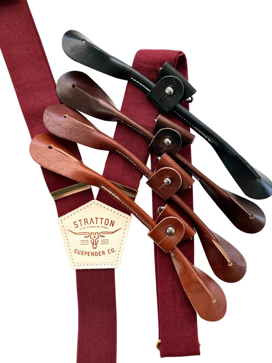 Bordeaux linen wedding suspenders with premium leather button-on tabs shown in black, chocolate, cognac, and tan with gold hardware.