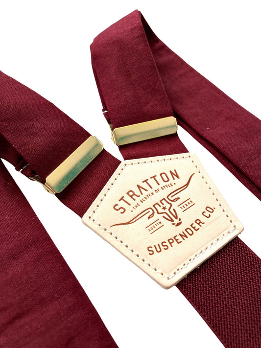 Rustic wedding suspenders in deep Bordeaux with gold adjusters and burgundy elastic—vintage-inspired button-on style for groomsmen.