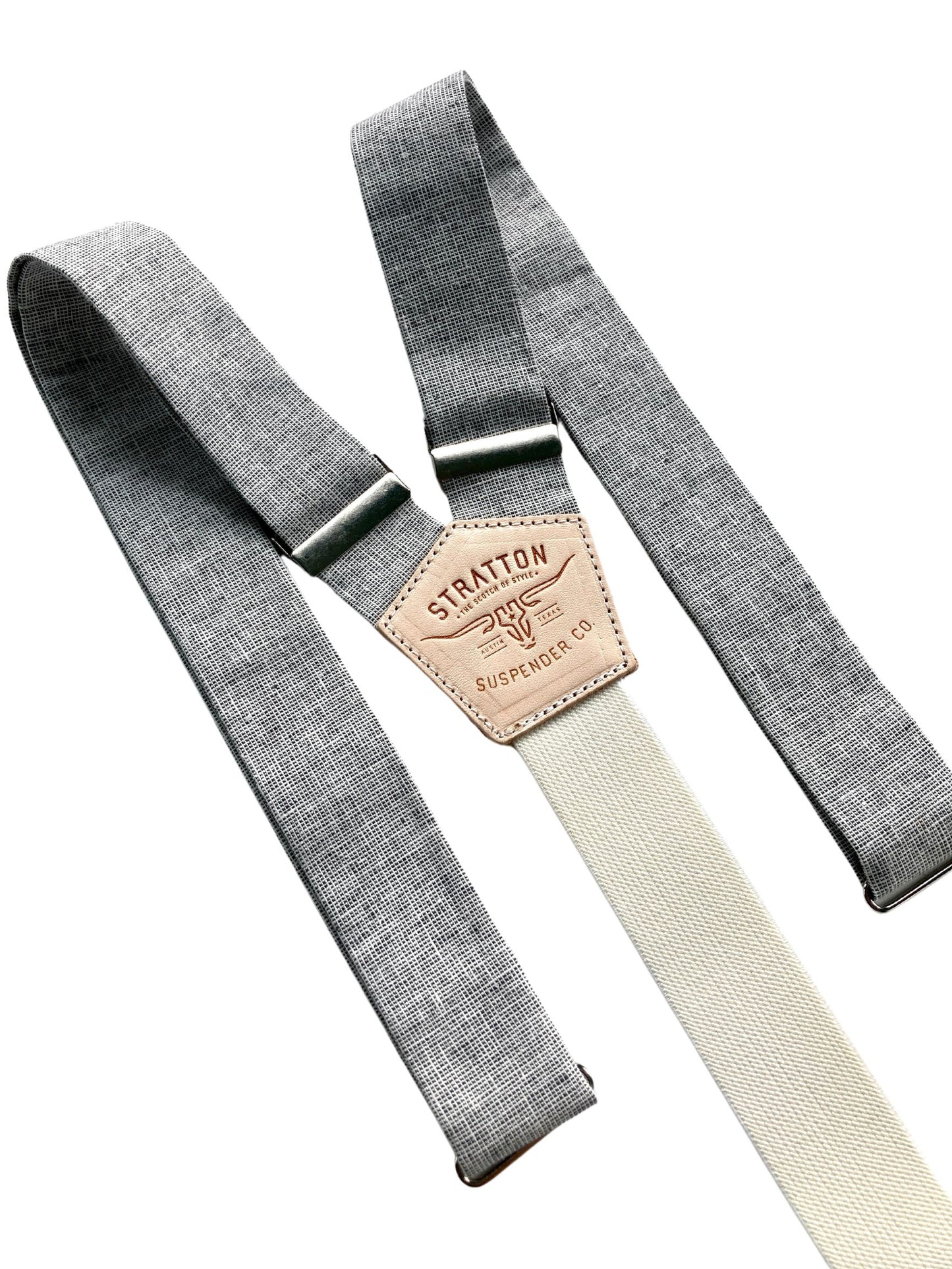 Close-up of handmade charcoal and beige woven linen button-on suspenders with natural leather back patch from Stratton Suspender Co., ideal for rustic weddings, groomsmen attire, and timeless men’s formalwear.