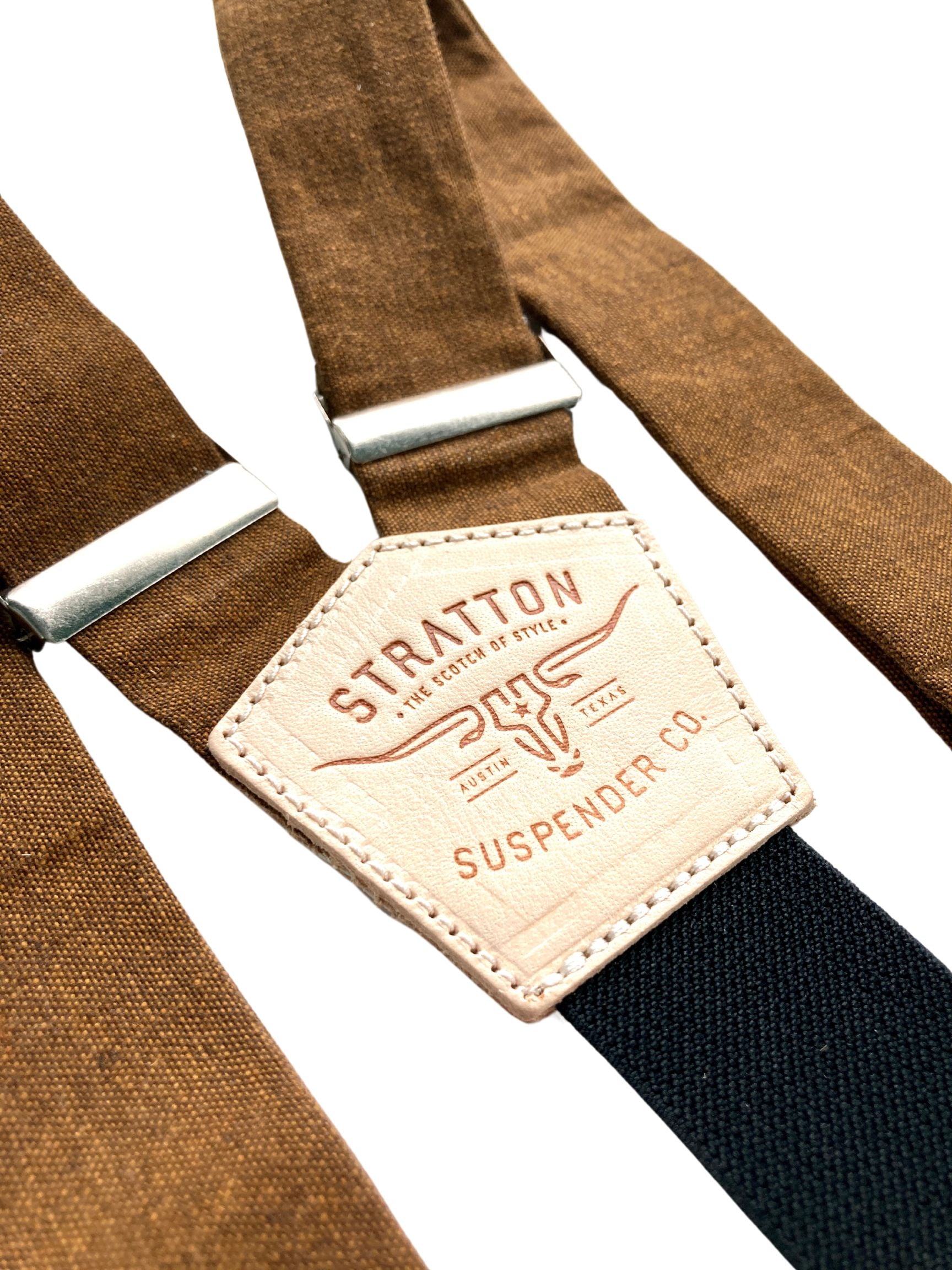 Close-up of handmade cinnamon brown linen button-on suspenders with premium full-grain leather back patch and antique brass adjusters, perfect for rustic weddings, groomsmen outfits, or vintage-inspired menswear.