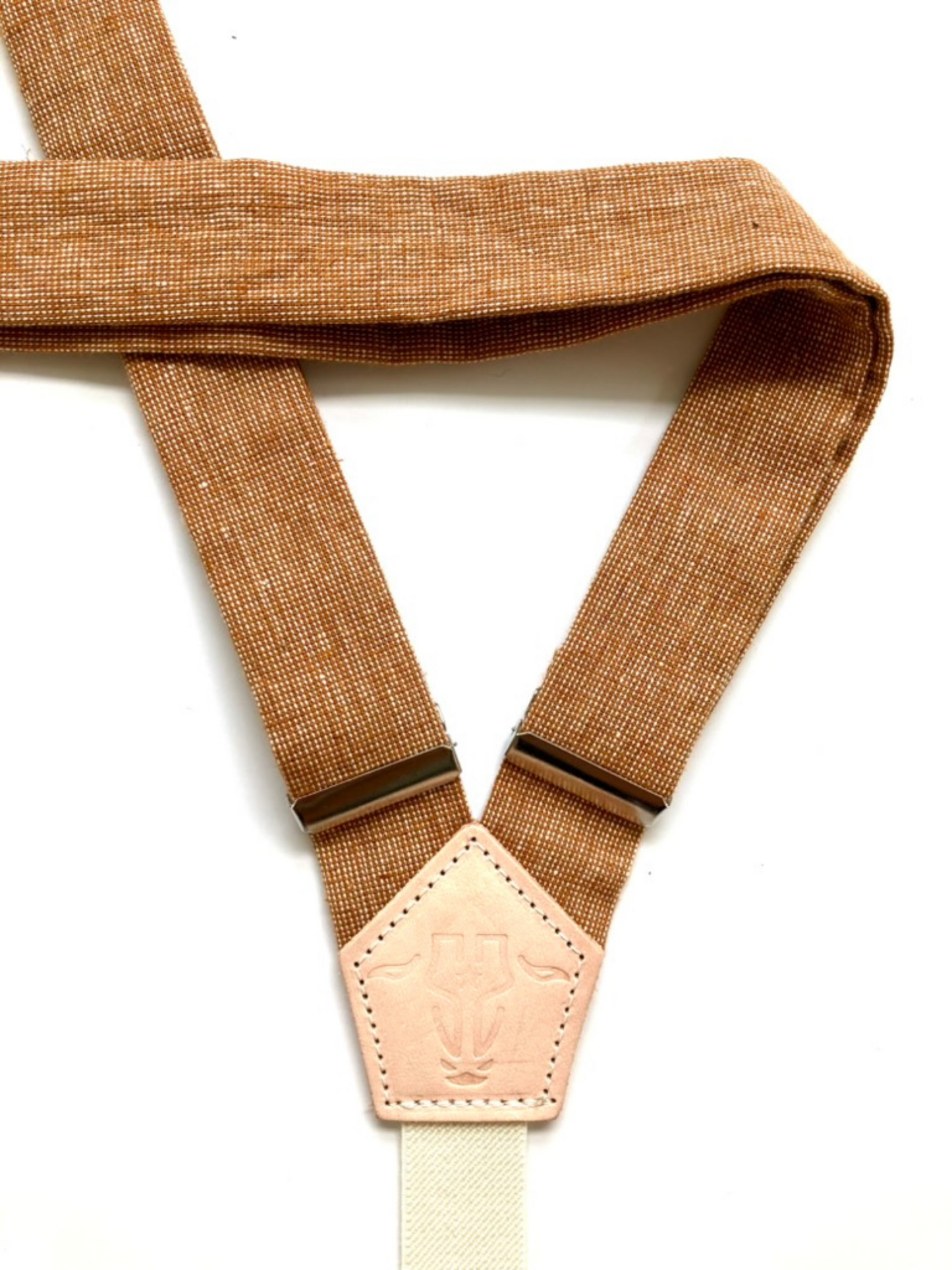 Back detail of Cinnamon Pecan women’s linen suspenders with vintage hand-woven texture and leather back patch, handmade in Texas.