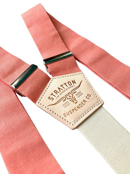 Close-up of Coral Linen suspenders with cream elastic back strap and natural leather patch by Stratton Suspender Co.