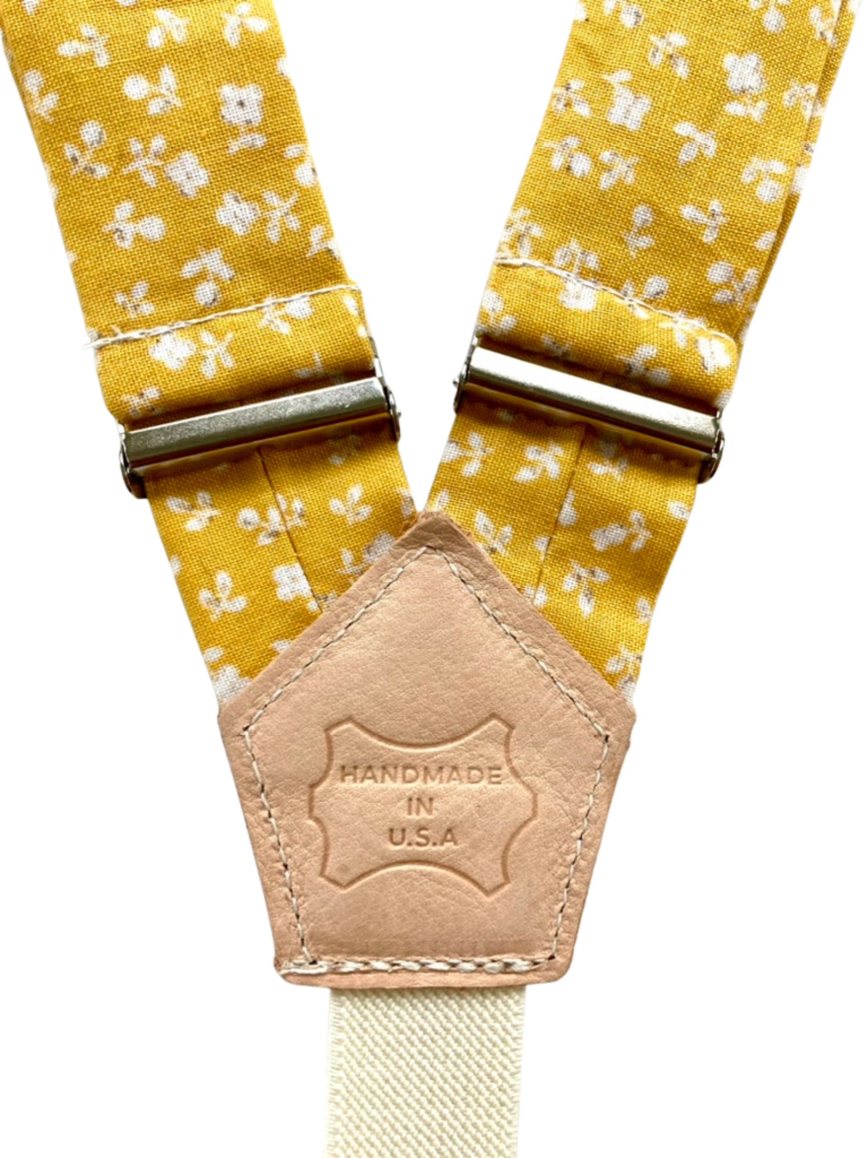 Marigold yellow floral suspender straps with leather back patch, handmade in Texas.