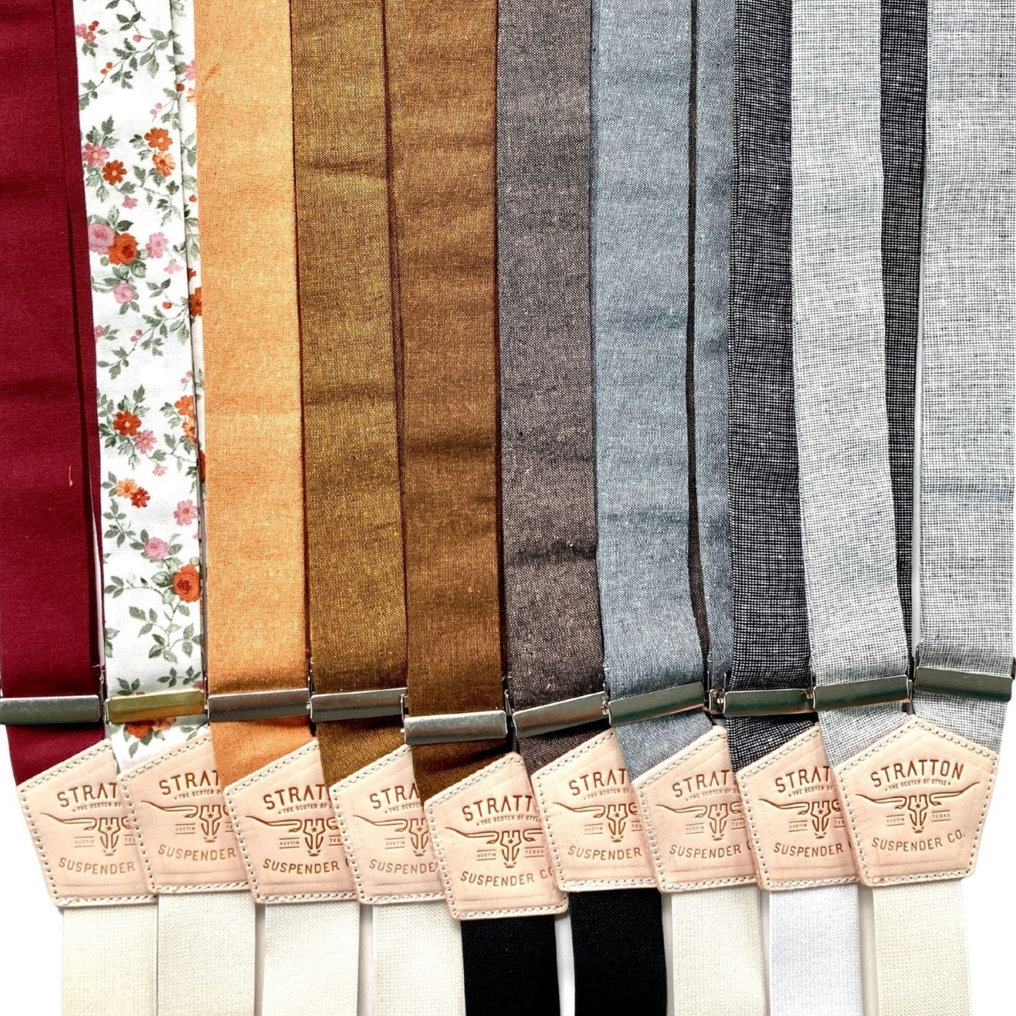 Lineup of Stratton handmade button-on suspenders in a full range of wedding and formal colors including burgundy, floral, rustic orange, brown, gray, and ivory — ideal for groomsmen, groom, and special occasion menswear.
