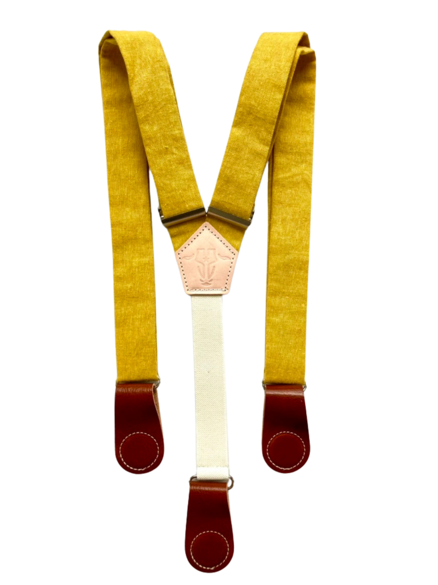 Full-view of mustard yellow women’s linen suspenders with tan leather magnetic clasps, handcrafted in Texas.
