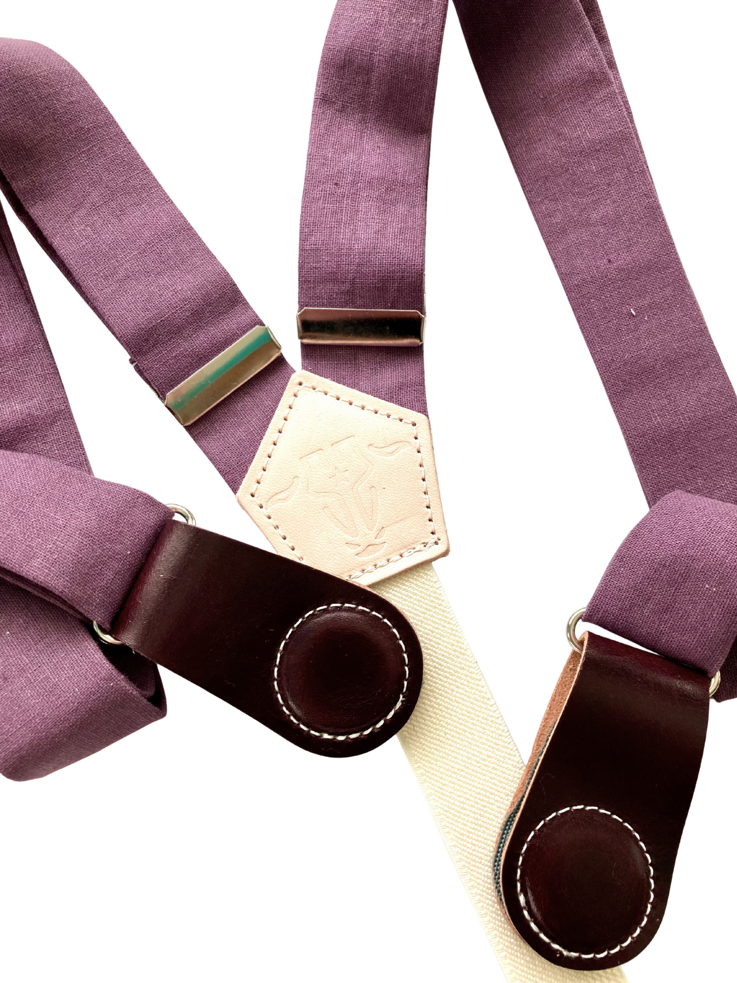 Detail shot of plum linen straps and wine leather magnetic clasps with premium stitching.