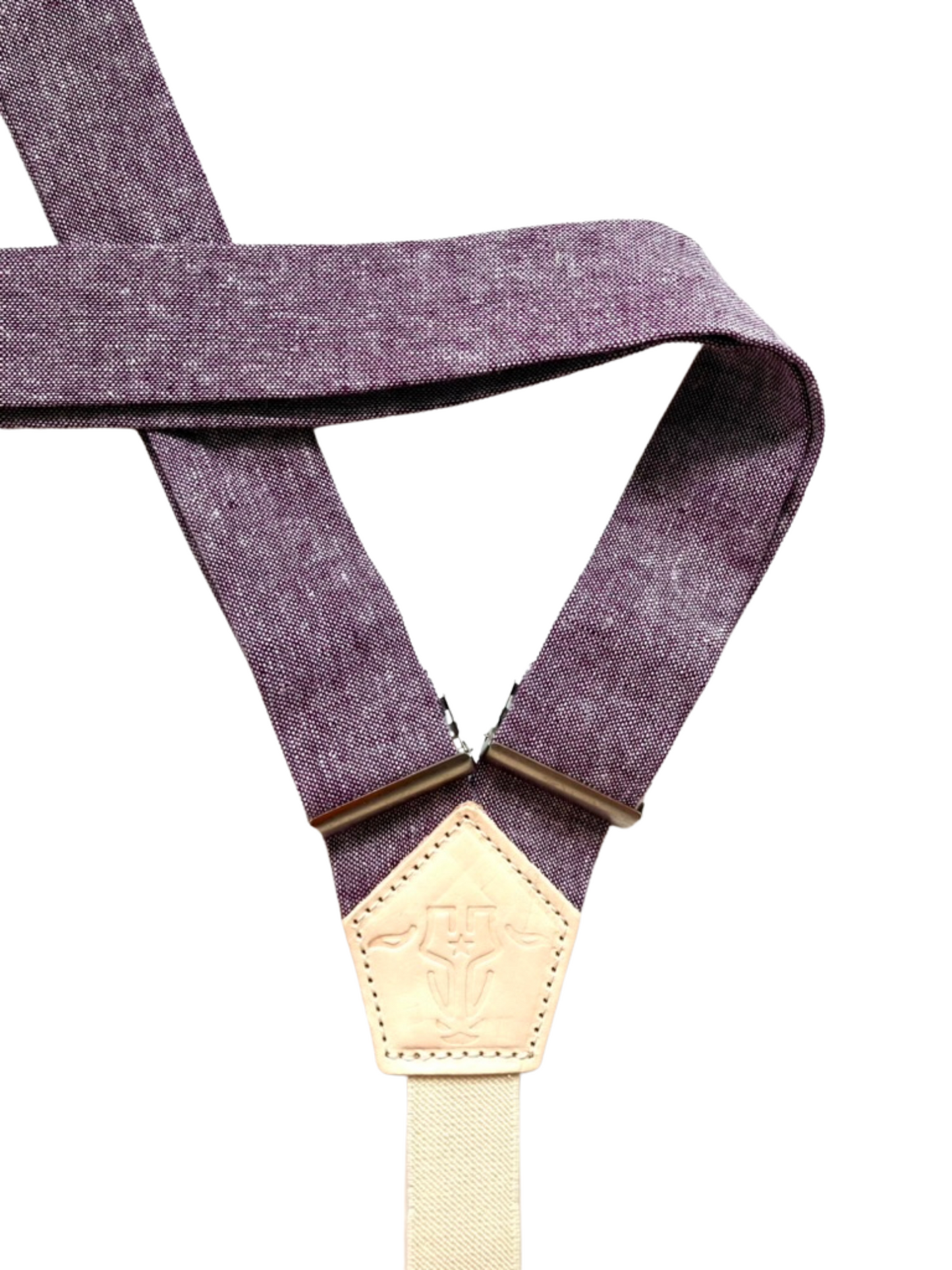 Close-up of purple linen women’s suspender straps with natural leather detailing, handcrafted for Americana and boho-inspired outfits.