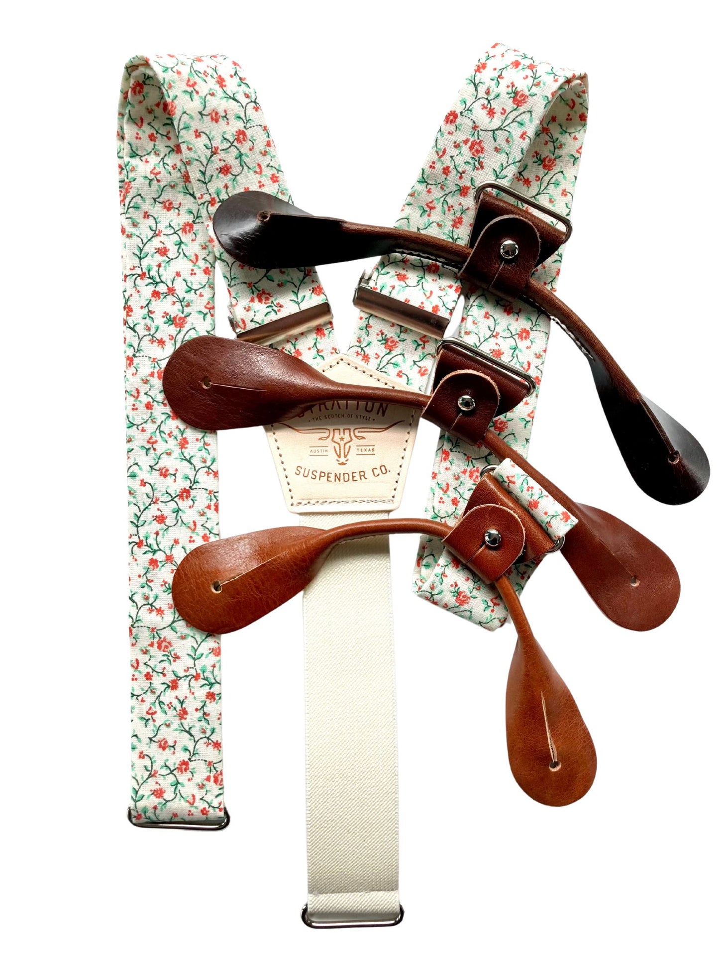 Full view of rustic orange and green floral suspenders with cream elastic back and brown leather button-on loops, handcrafted by Stratton Suspender Co. for rustic weddings and vintage formalwear.