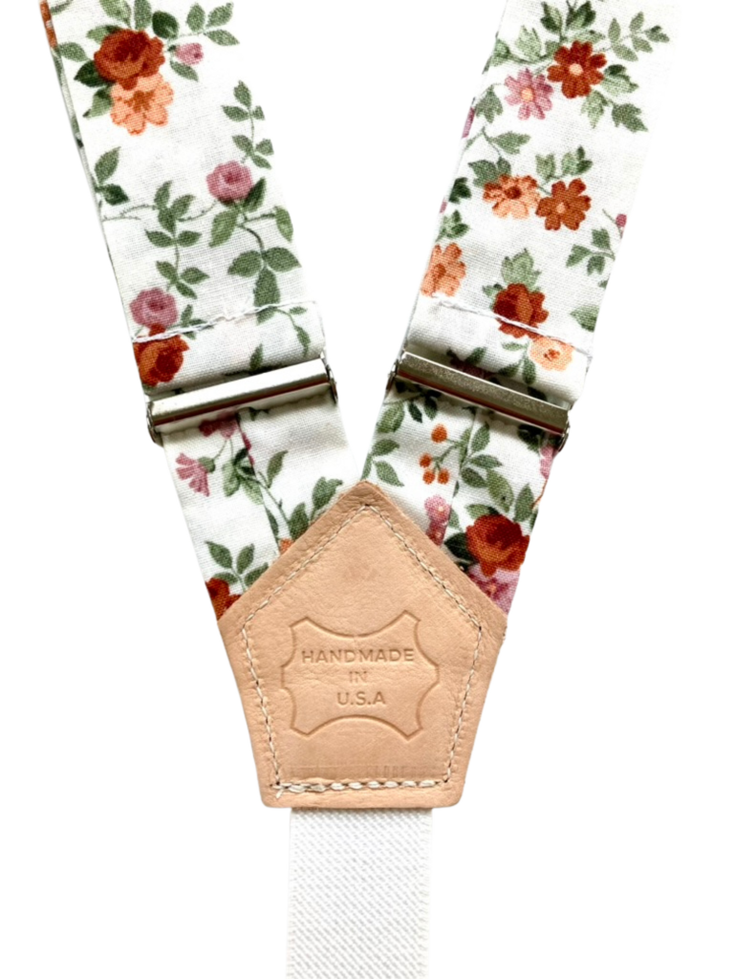 Floral linen women’s suspenders with leather patch detail, handmade in Texas by Stratton Suspender Co.