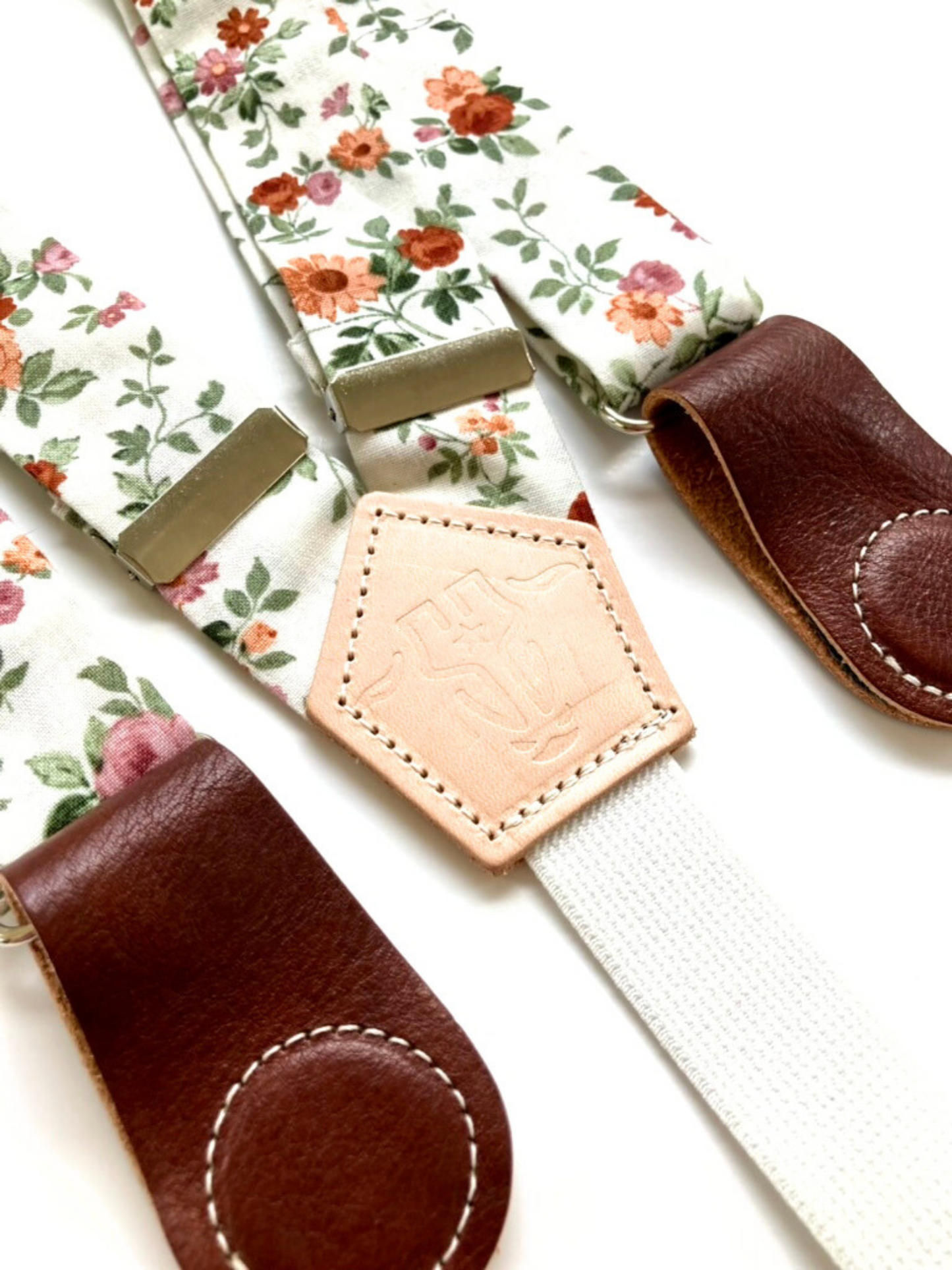 Rustic rose floral women’s suspenders with leather magnetic clasps, handmade in Texas for boho festival outfits and year-round style.