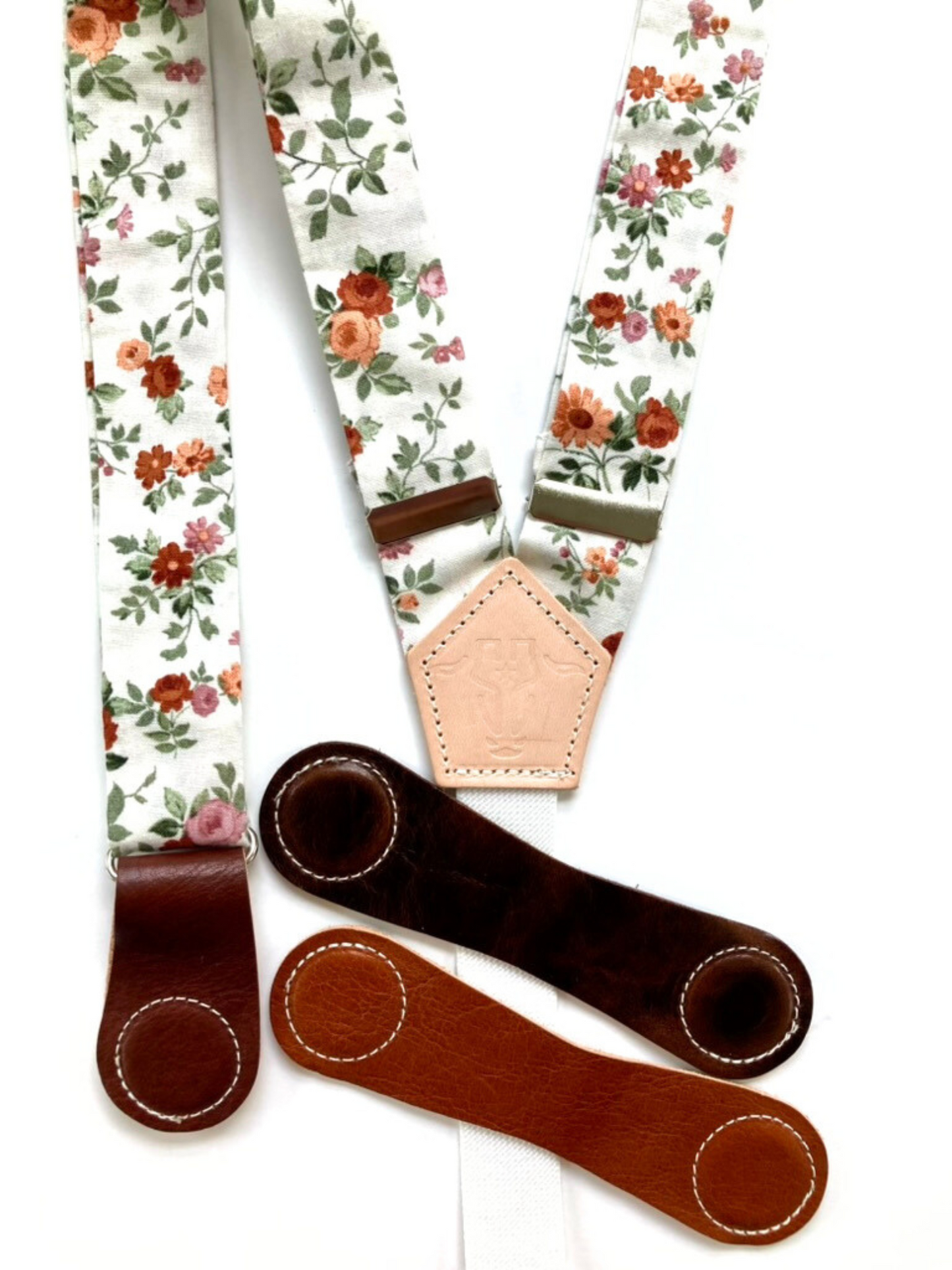 Rustic rose floral women’s suspenders with cognac, tan, and chocolate leather magnetic clasp options, handmade in Texas.