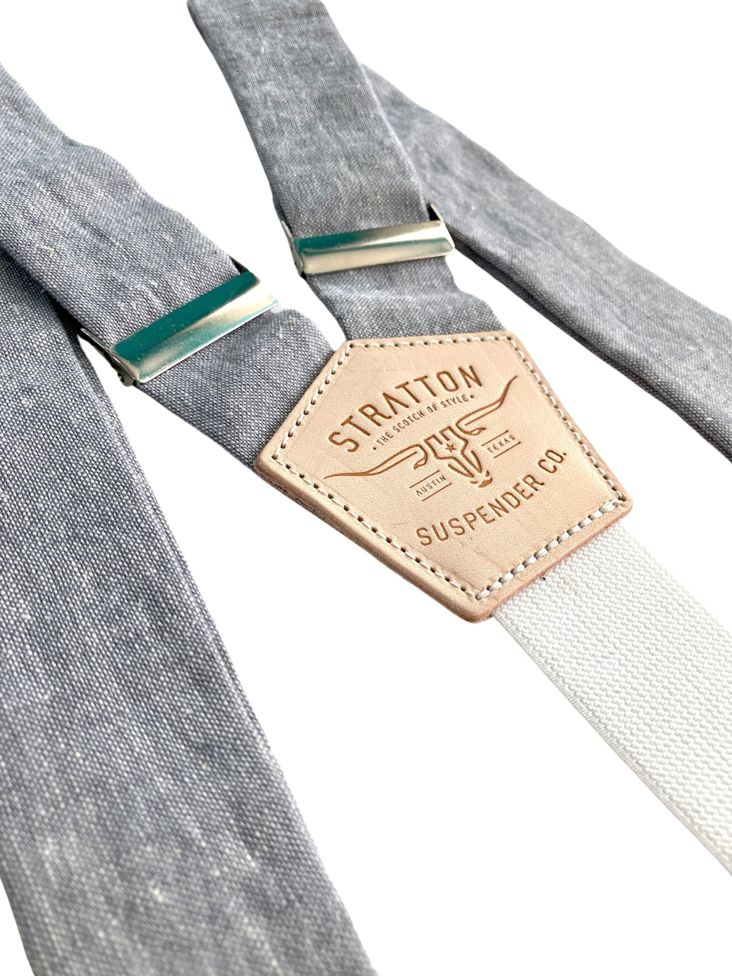 Close-up of steel gray linen suspenders with polished silver hardware and soft elastic back strap. Handmade men's button-on braces with rustic modern style, perfect for weddings, vintage fashion, and heritage workwear.