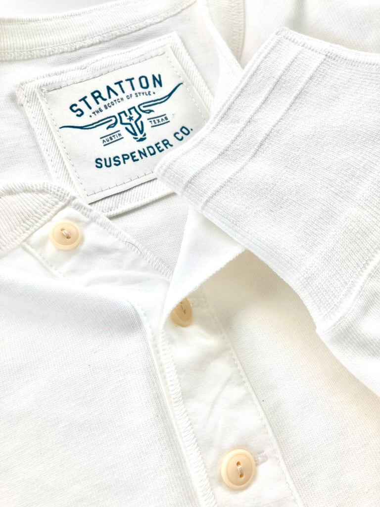 Close-up of Vintage 1940s Heavyweight Henley in Vintage White by Stratton Suspender Co. Features three-button placket, ribbed cuffs, and embroidered brand label stitched onto soft cotton. Made in the USA, designed for durability and heritage workwear style.