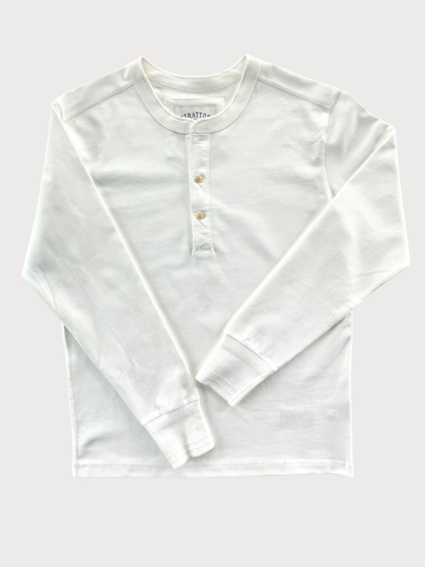 Vintage 1940s White Heavyweight Henley by Stratton Suspender Co. Features a three-button placket, ribbed cuffs, and premium heavyweight cotton. Made in the USA for durability, comfort, and classic heritage workwear style.
