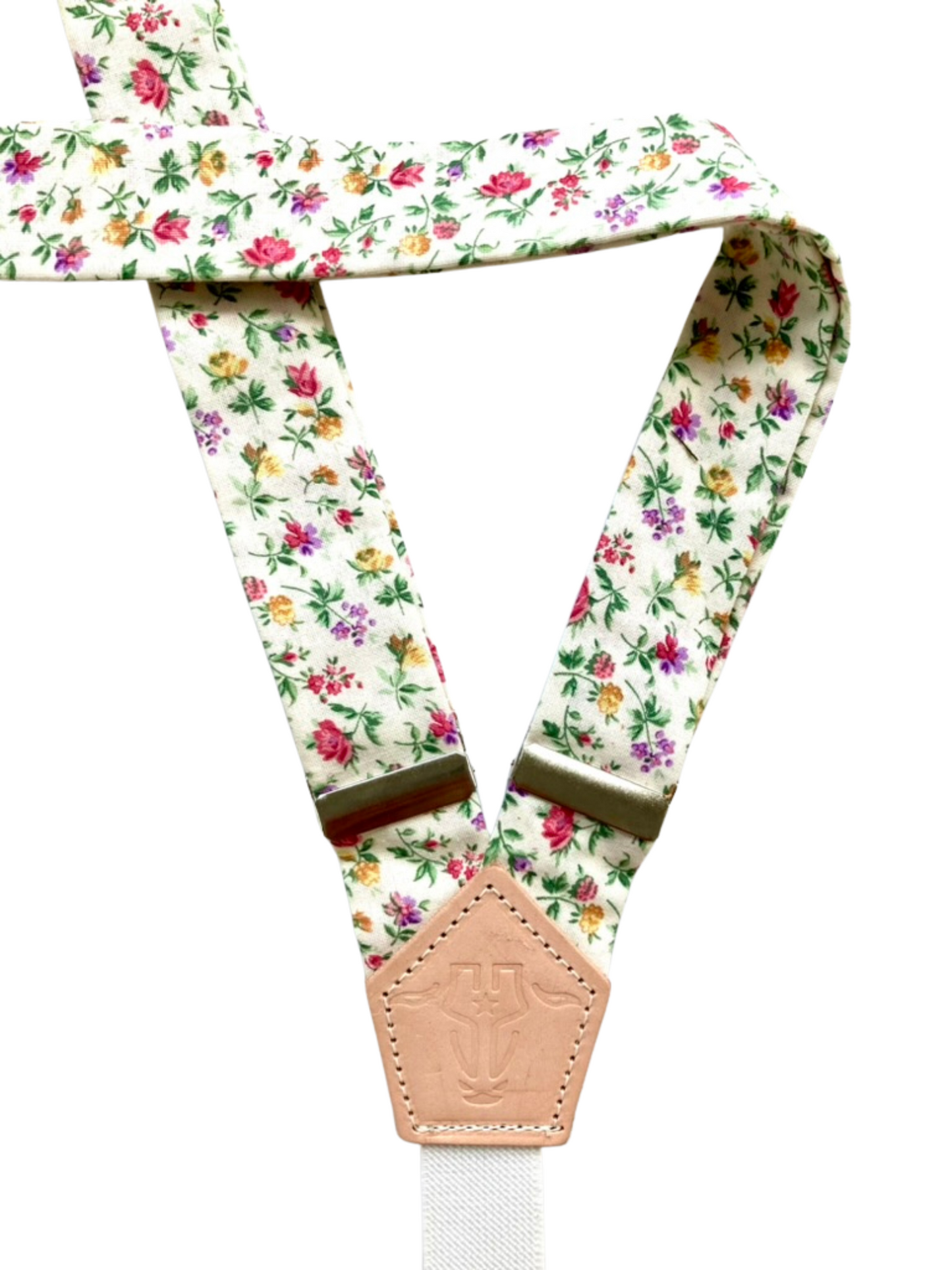 Back detail of vintage rose garden floral women’s suspenders with cotton straps and leather accents.