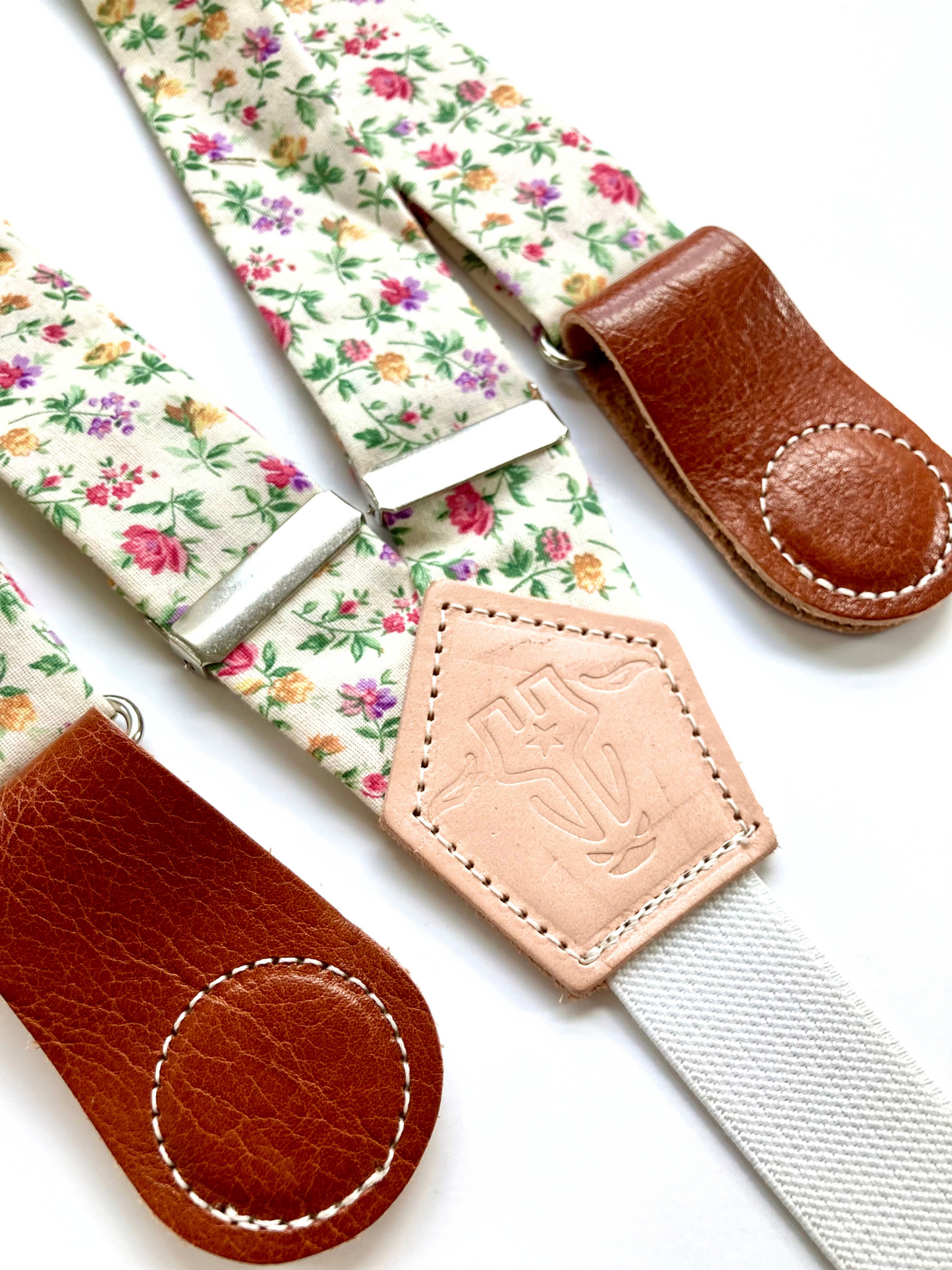 Vintage rose garden floral women’s suspenders with leather magnetic clasps, handmade in Texas for spring and summer outfits.