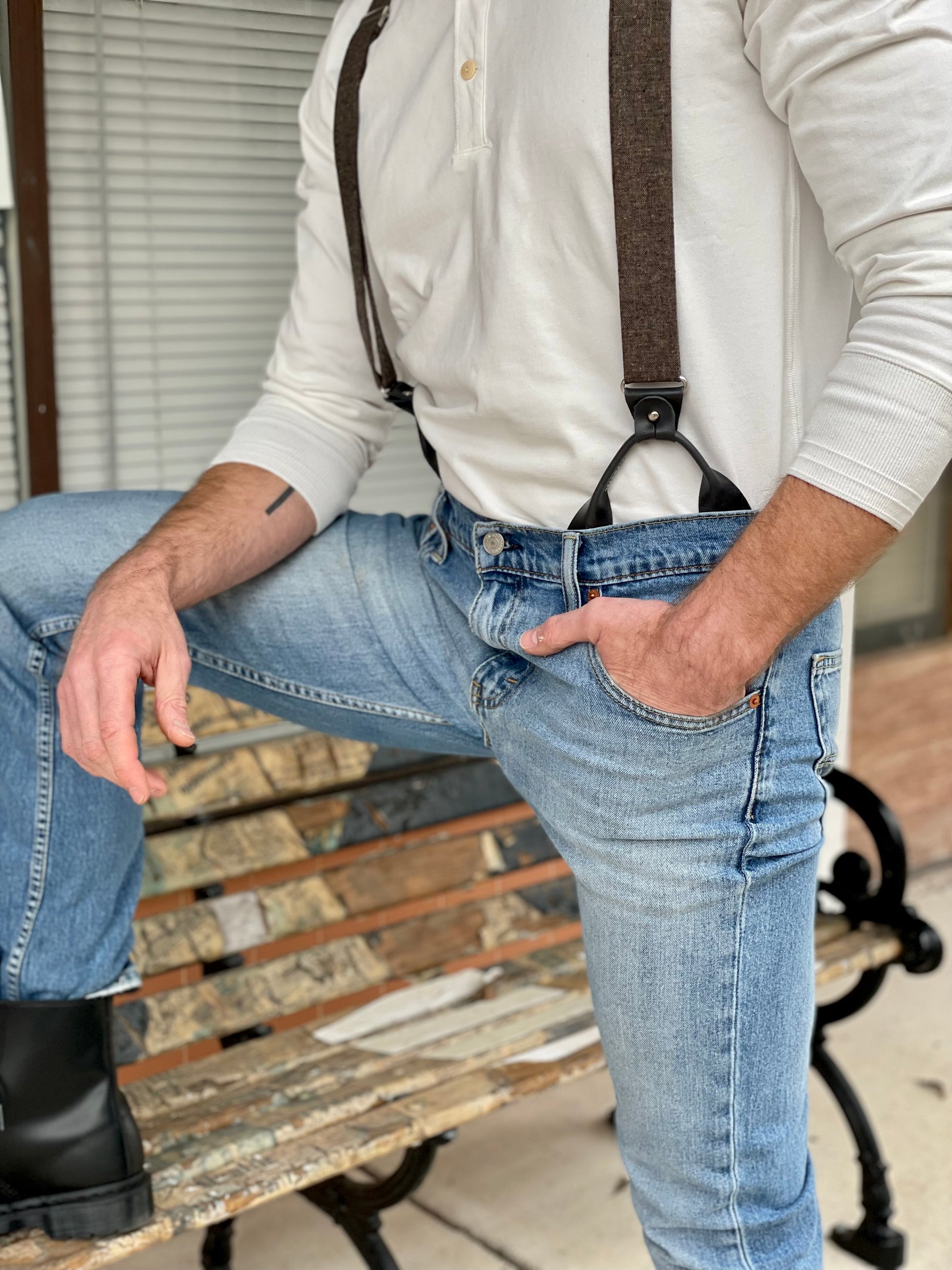 Man wearing a Vintage White Henley and brown wool suspenders by Stratton Suspender Co., paired with denim and black boots. A rugged heritage workwear look inspired by classic American craftsmanship.