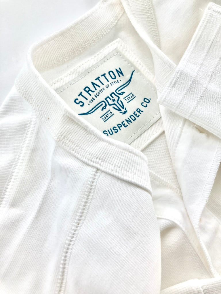 Close-up of Vintage White Henley by Stratton Suspender Co., showcasing a durable flatlock shoulder seam for enhanced fit and comfort. Features ribbed cuffs, premium USA cotton, and heritage-inspired craftsmanship—built for timeless American workwear style.