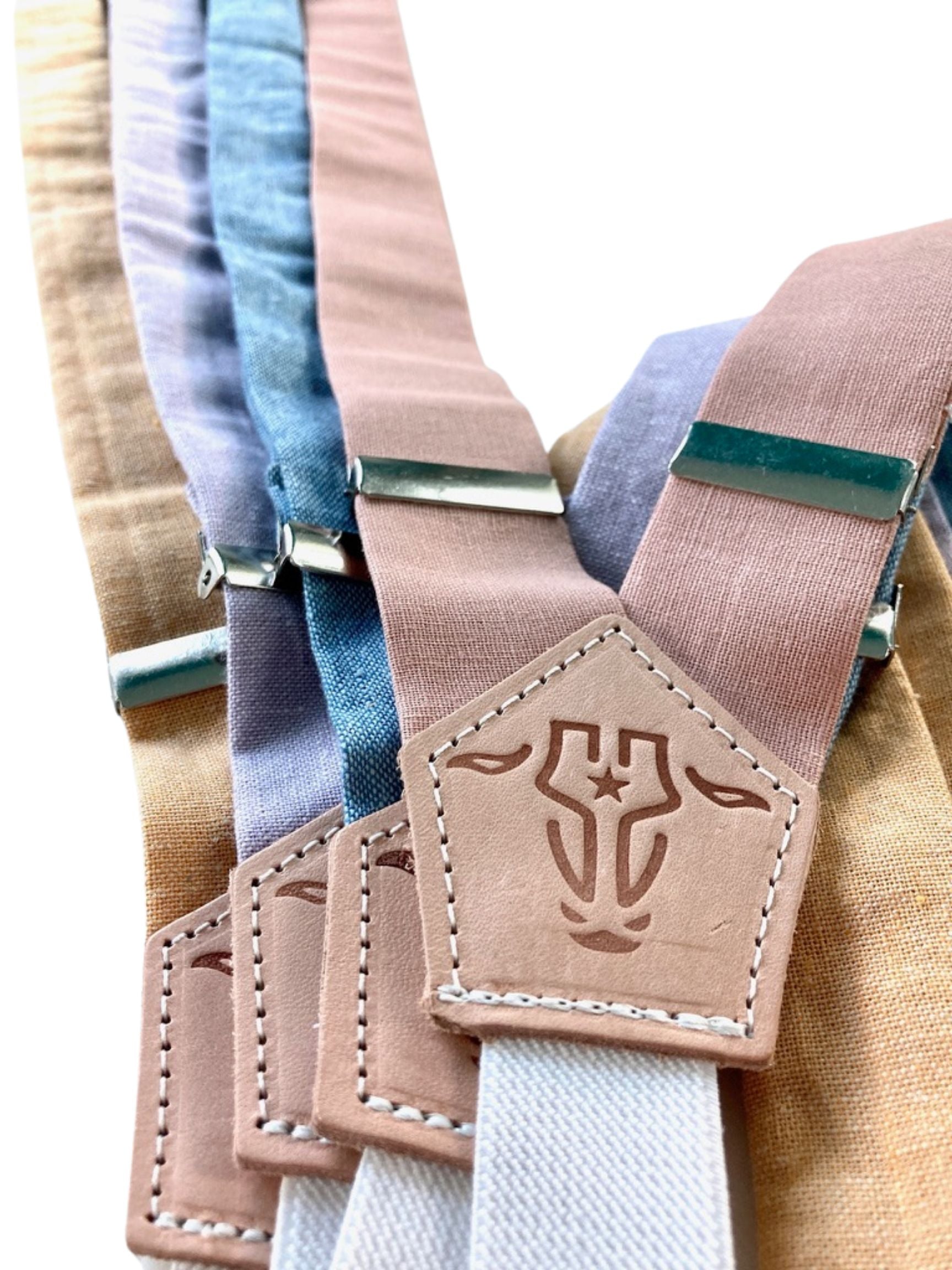 Handmade women’s linen suspenders with pastel straps and premium leather back detail.