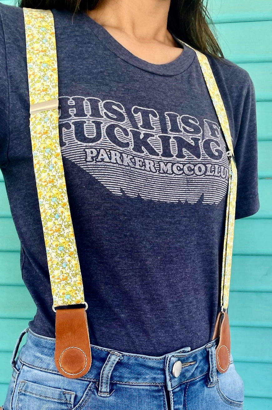 Magnetic clasp suspenders for women styled casually with high-waisted jeans and tee