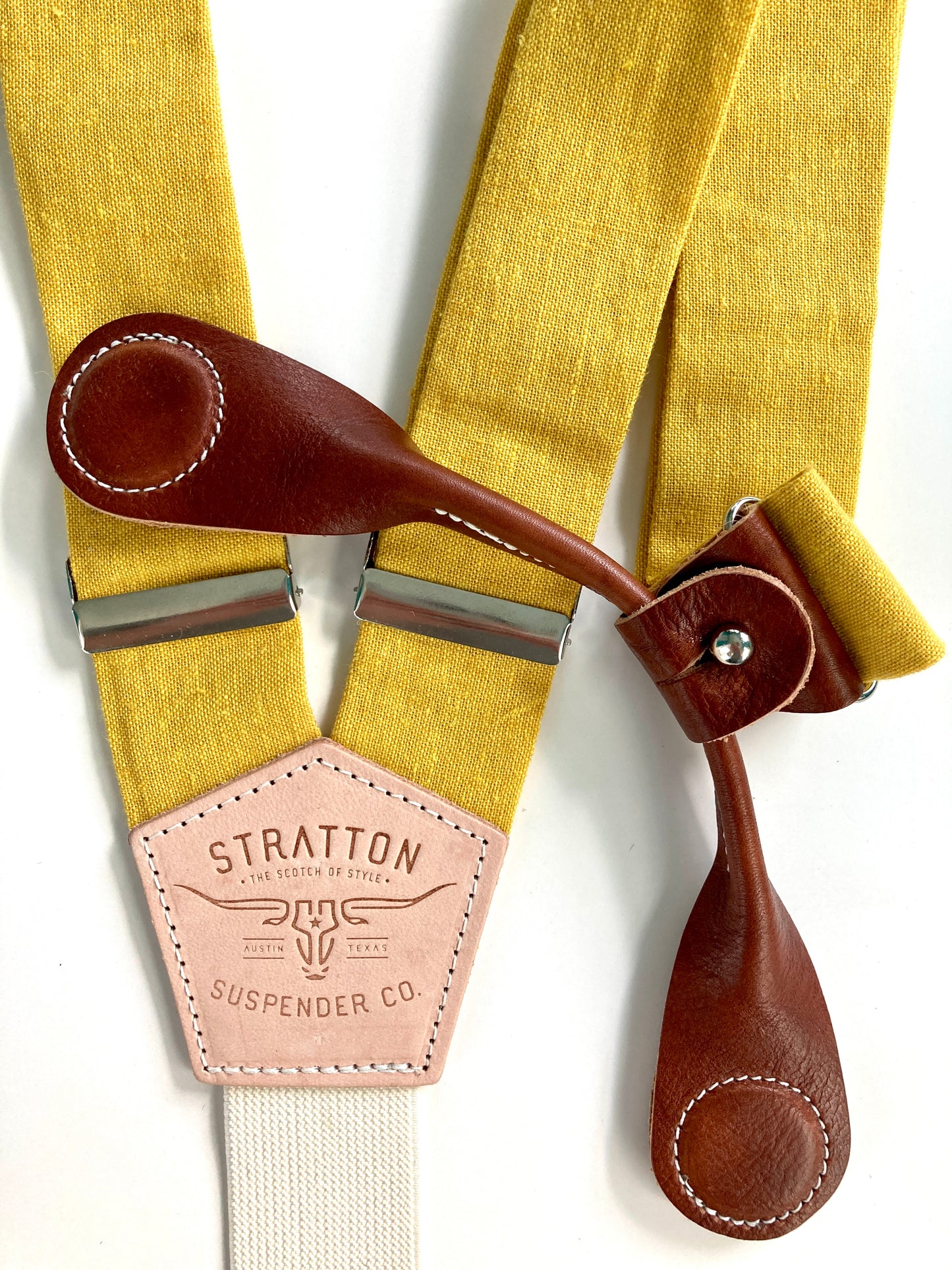 Stratton Suspender Co. features the Yellow linen suspenders on veg tan shoulder leather with cream colored elastic back strap for the Fall 2022 suspenders collection Magnetic Stratton Suspender clasps in Cognac Pontedero Italian leather hand-picked by Stratton Suspender Co.