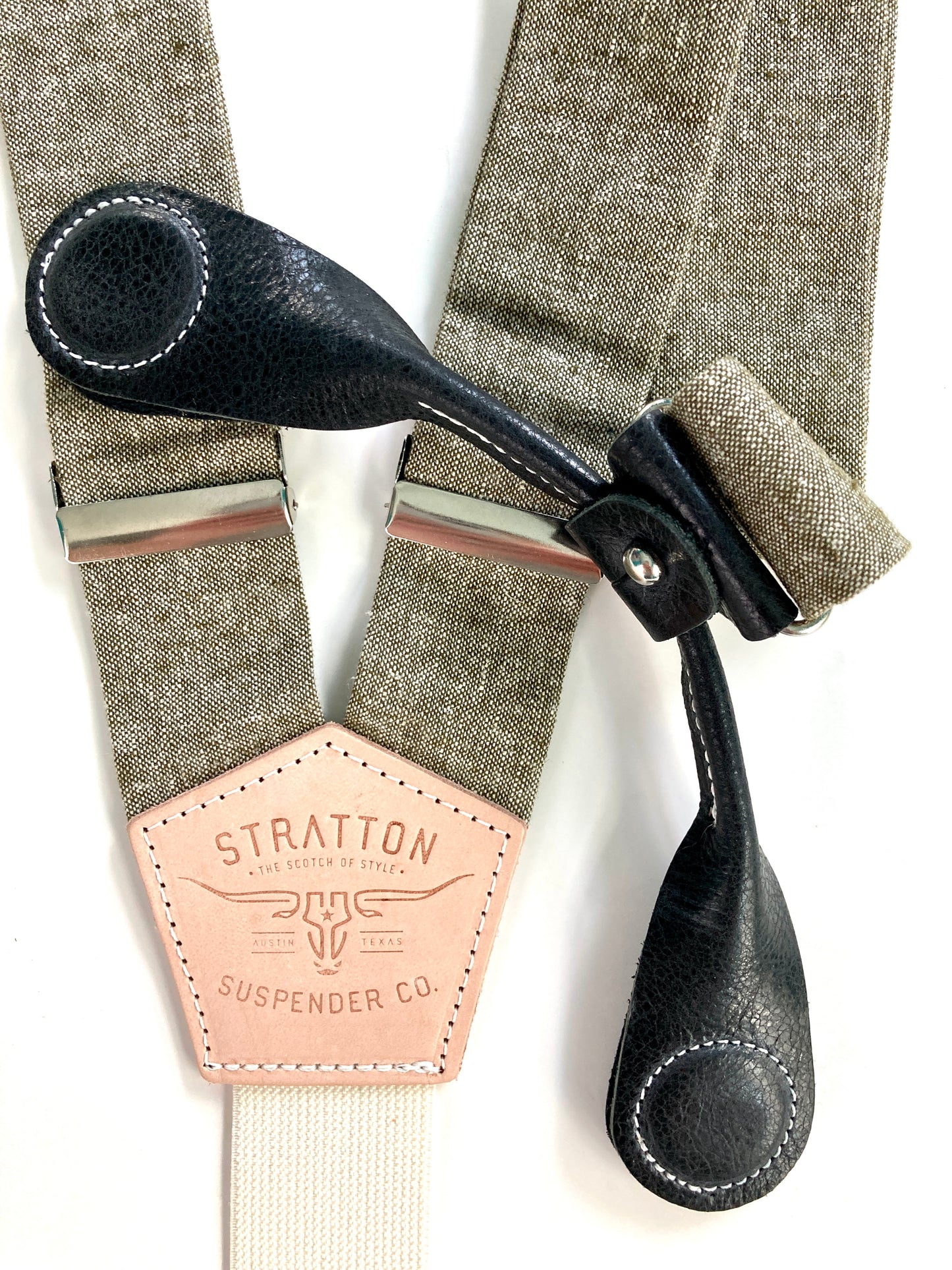 Stratton Suspender Co. features the Olive Green linen suspenders on veg tan shoulder leather with cream colored elastic back strap for the Fall 2022 suspenders collection Magnetic Stratton Suspender clasps in Black Pontedero Italian leather hand-picked by Stratton Suspender Co.