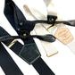Handmade black and ivory linen button-on suspenders with full-grain veg-tan leather, gold-colored solid brass hardware, and premium soft twill elastic. Ethically made in Texas, perfect for formal wear, weddings, and black-tie events. Timeless, heritage-inspired style.