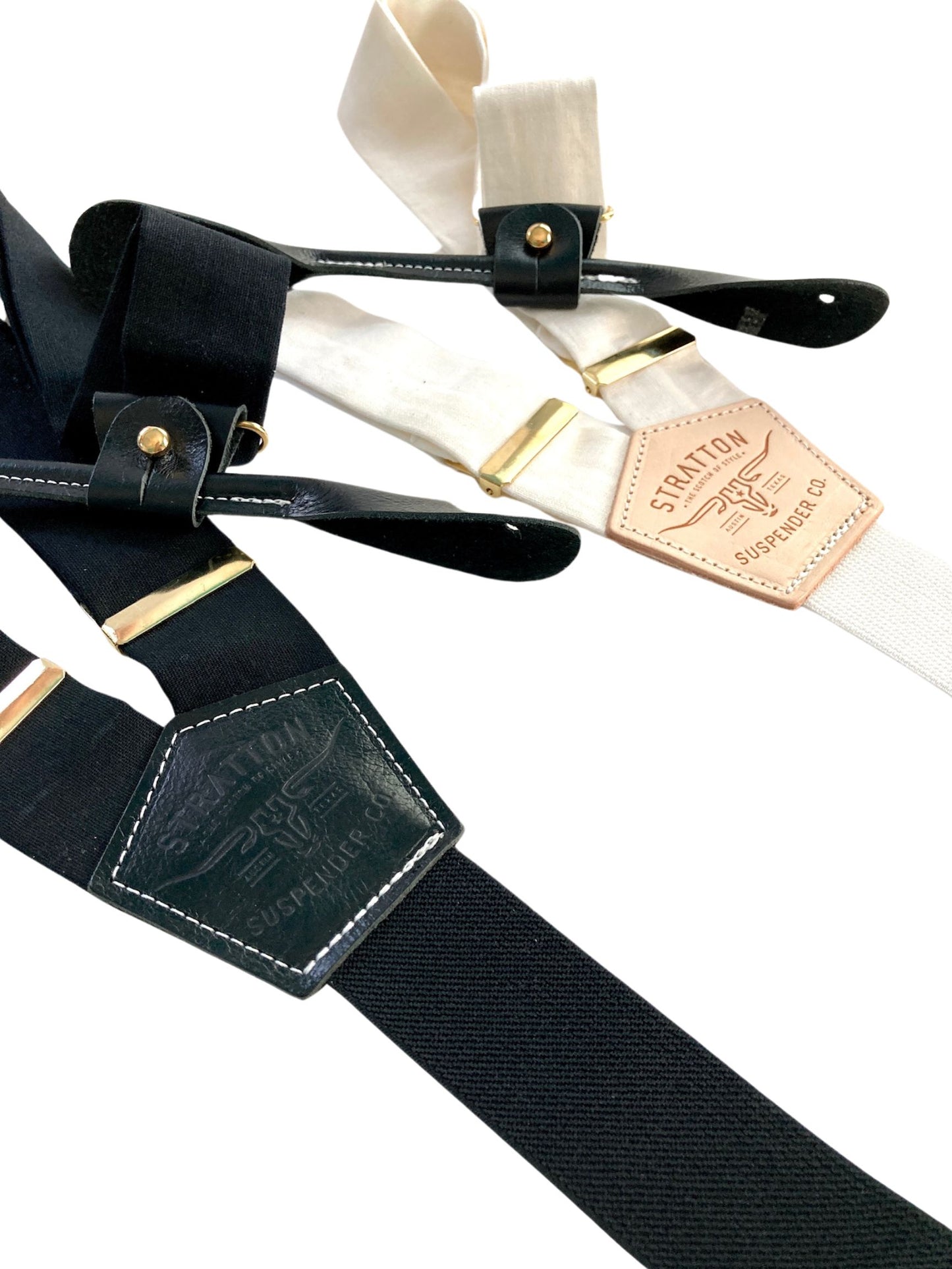 Handmade black and ivory linen button-on suspenders with full-grain veg-tan leather, gold-colored solid brass hardware, and soft twill elastic. Ethically made in Texas, perfect for weddings, formal wear, groomsmen, and heritage menswear. Timeless and refined style.