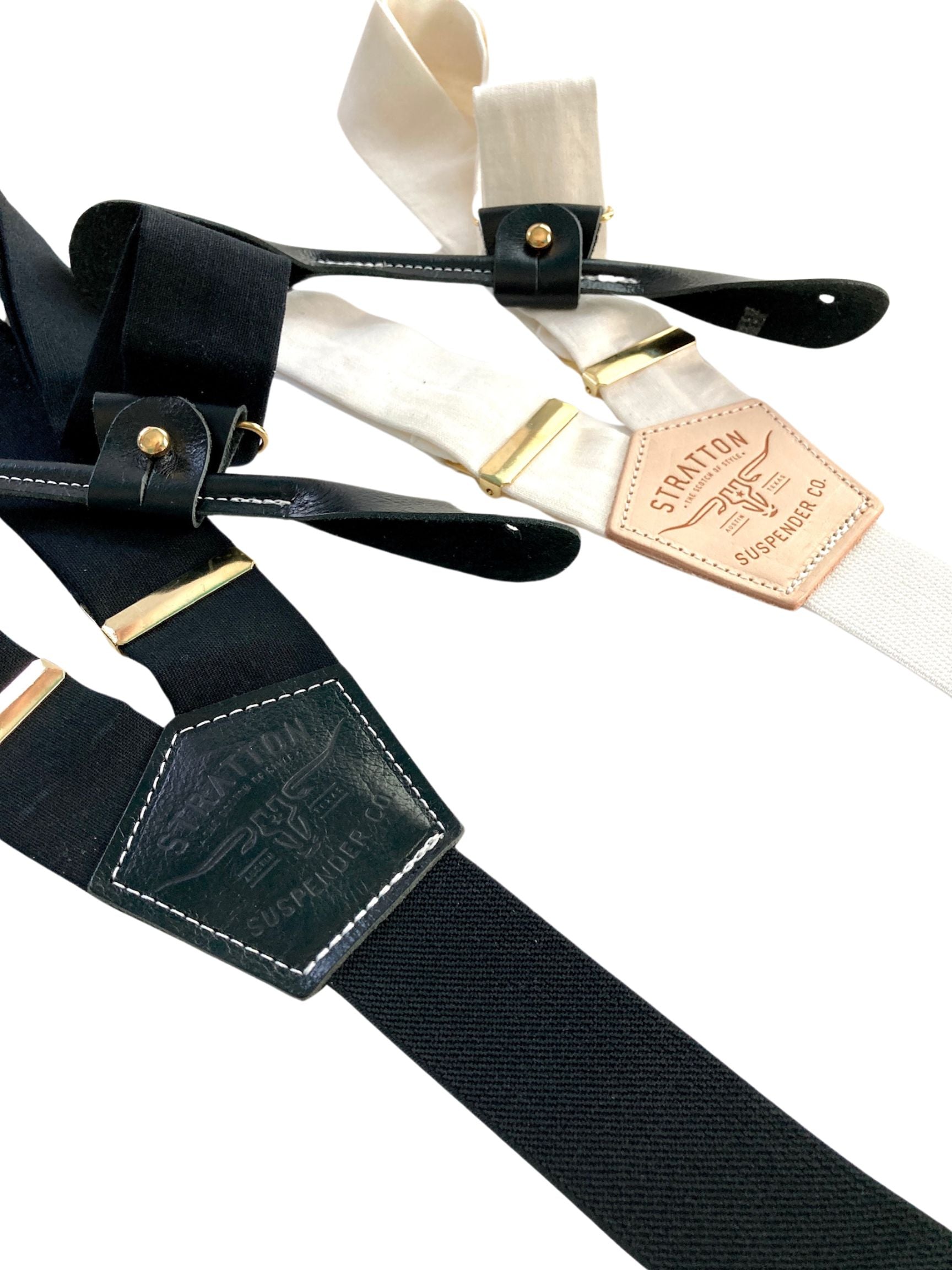 Handmade black and ivory linen button-on suspenders with full-grain veg-tan leather, gold-colored solid brass hardware, and soft twill elastic. Ethically made in Texas, perfect for weddings, formal wear, groomsmen, and heritage menswear. Timeless and refined style.