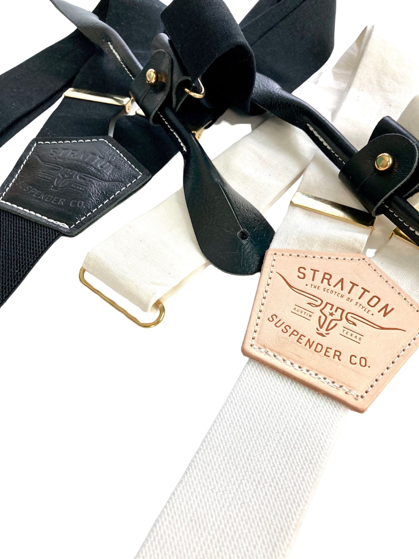 Handmade black and ivory linen button-on suspenders with full-grain veg-tan leather, gold-colored solid brass hardware, and premium soft twill elastic. Ethically made in Texas, perfect for formal wear, weddings, groomsmen, and heritage menswear. Timeless and refined.