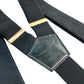 Handmade black linen button-on suspenders with full-grain veg-tan leather, gold-colored solid brass hardware, and premium soft twill elastic. Ethically made in Texas, perfect for formal wear, weddings, groomsmen, and heritage menswear. Timeless and refined.