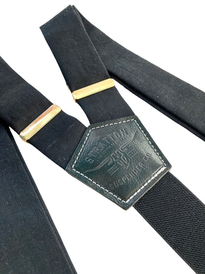 Handmade black linen button-on suspenders with full-grain veg-tan leather, gold-colored solid brass hardware, and premium soft twill elastic. Ethically made in Texas, perfect for formal wear, weddings, groomsmen, and heritage menswear. Timeless and refined.