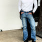Man wearing black linen button-on suspenders styled with a white waffle-knit shirt, vintage denim, and black leather boots. A refined yet rugged look for weddings, groomsmen, and heritage menswear enthusiasts.