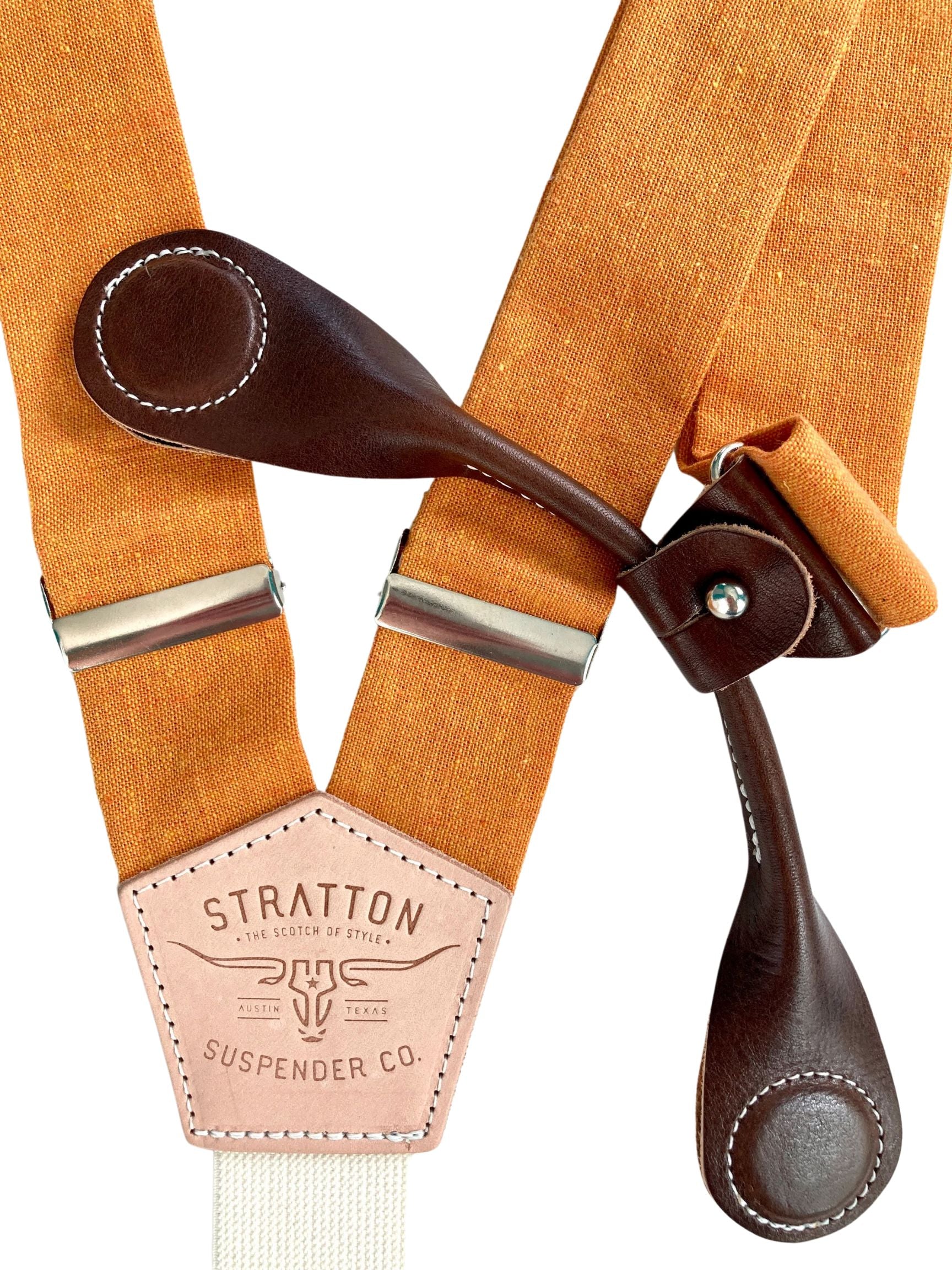 Stratton Suspender Co. features the orange linen suspenders on veg tan shoulder leather with cream colored elastic back strap for the Fall suspenders collection clasps in chocolate Pontedero Italian leather hand-picked by Stratton Suspender Co.