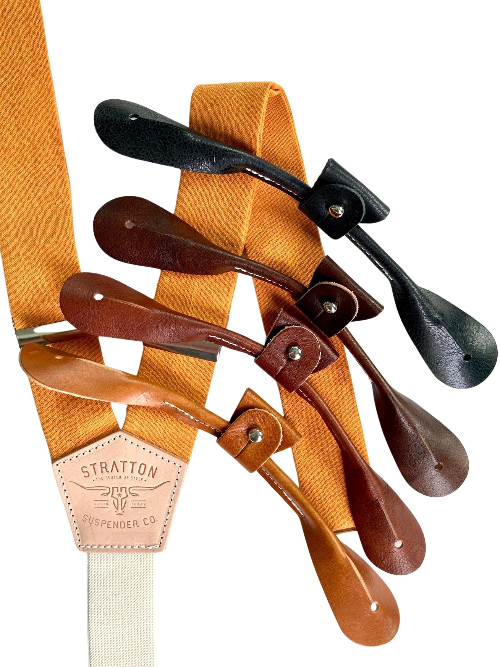 Orange Linen Stratton Suspender Co. Set with one button on attachment in the following colors from top to bottom: Black, Chocolate (dark brown), Cognac (reddish brown), Tan (light brown)