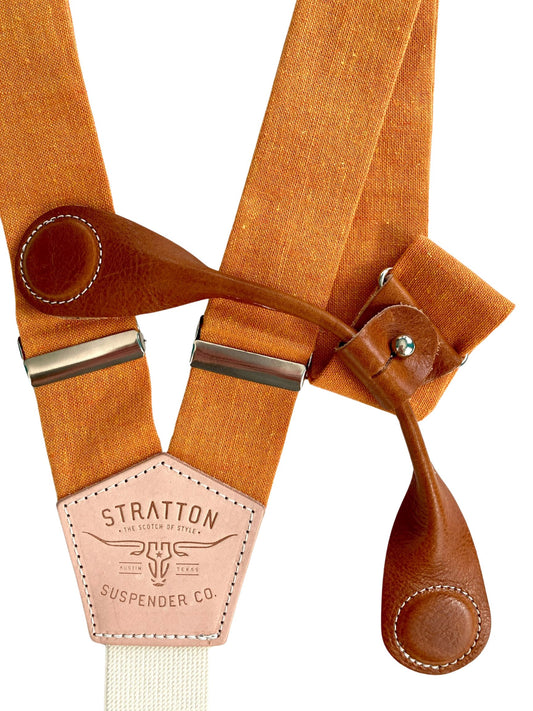 Stratton Suspender Co. features the orange linen suspenders on veg tan shoulder leather with cream colored elastic back strap for the Fall 2022 suspenders collection clasps in black Pontedero Italian leather hand-picked by Stratton Suspender Co.