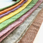 Close up photo of Stratton Suspender Co. Linen Formal Suspender Straps in Nutmeg, Olive, Rust, Kelly Green, Mustard Yellow, Plum Purple, Tangerine Orange, and palm or Chartreuse Green
