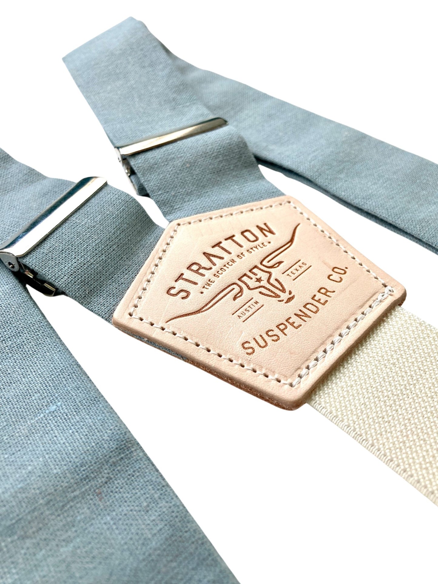 Dusty blue linen wedding button on suspenders for groom and groomsmen