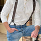 Man wearing Espresso Brown Linen Button-On Suspenders with Black Leather Attachments, paired with a Vintage White Henley and Classic Denim – Handmade by Stratton Suspender Co. for timeless American heritage style.