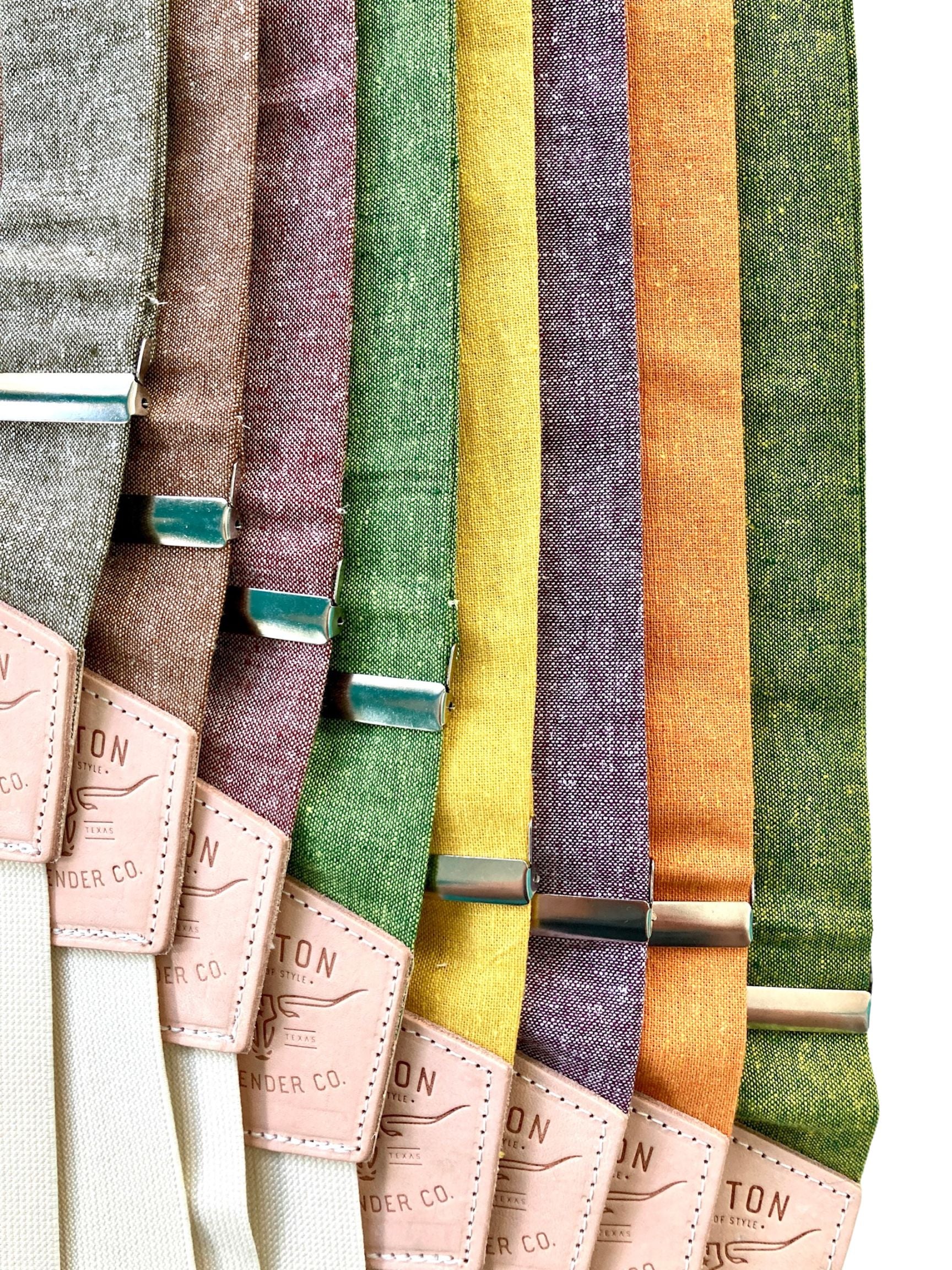 Stratton Suspender Co. Fall Linen Collection laid out in the following order: Nutmeg (Brown), Yellow, Maroon or Rust, Spruce (Bright Green), Olive Green, Purple, Orange, Palm (green and yellow woven linen)