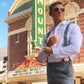 Stratton Suspenders Black Linen with Cognac Clasps at the Paramount Theater Downtown Austin in White Dress Shirt and Grey Dress Pants