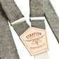 Stratton Suspender Co. features the olive green linen suspenders on veg tan shoulder leather with cream colored elastic back strap for the Fall 2022 suspenders collection