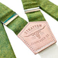 Stratton Suspender Co. features the Palm green with yellow woven threaded linen suspenders on veg tan shoulder leather with cream colored elastic back strap for the Fall 2022 suspenders collection 