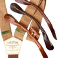 Handmade roasted pecan and burnt orange button-on suspenders with premium veg-tan leather attachments in tan, cognac, or chocolate. Designed for groomsmen, weddings, and vintage menswear, these suspenders feature a woven elastic back strap and gold brass hardware for a refined, monochrome brown aesthetic.