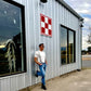 Vintage Charcoal Button-On Suspenders by Stratton Suspender Co. Styled with White Vintage T-Shirt and Levis Jeans in Front of Texas Farm and Ranch Store – Effortless Austin Texas Street Style – Heritage American Style with Laid-Back Charm.