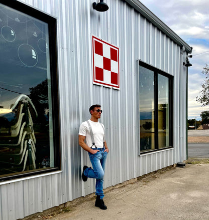 Vintage Charcoal Button-On Suspenders by Stratton Suspender Co. Styled with White Vintage T-Shirt and Levis Jeans in Front of Texas Farm and Ranch Store – Effortless Austin Texas Street Style – Heritage American Style with Laid-Back Charm.