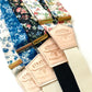 Vintage Floral Wedding Suspenders with Gold Hardware and Leather Details – Linen Button-On Braces in Blue, Black, Cream, and Ivory Floral Patterns. Perfect for Rustic, Boho, and Vintage Weddings. Handmade by Stratton Suspender Co.